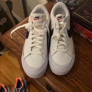 Nike White Sneakers with Black Swoosh